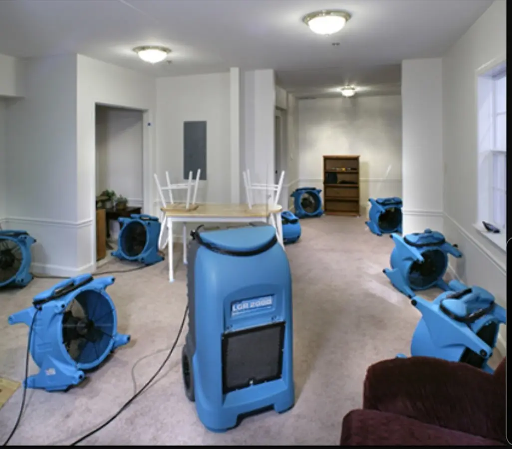 Air movers and dehumidifier setup for Water Damage Restoration in DuPont